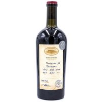 A stout wine bottle with broad shoulders. There is a run seal on the dork and a white label. The Label says Tchotisashvhili Winery, and names the grape, takvevri.