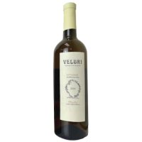 A simple looking bottle of wine. Cream while capsule and label on dark glass. The wine is Veluri Mtsvane, and amber wine from Georgia.