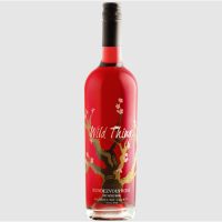 A750ml clear glass bottle of magenta pink carol shelton wild thing rose.